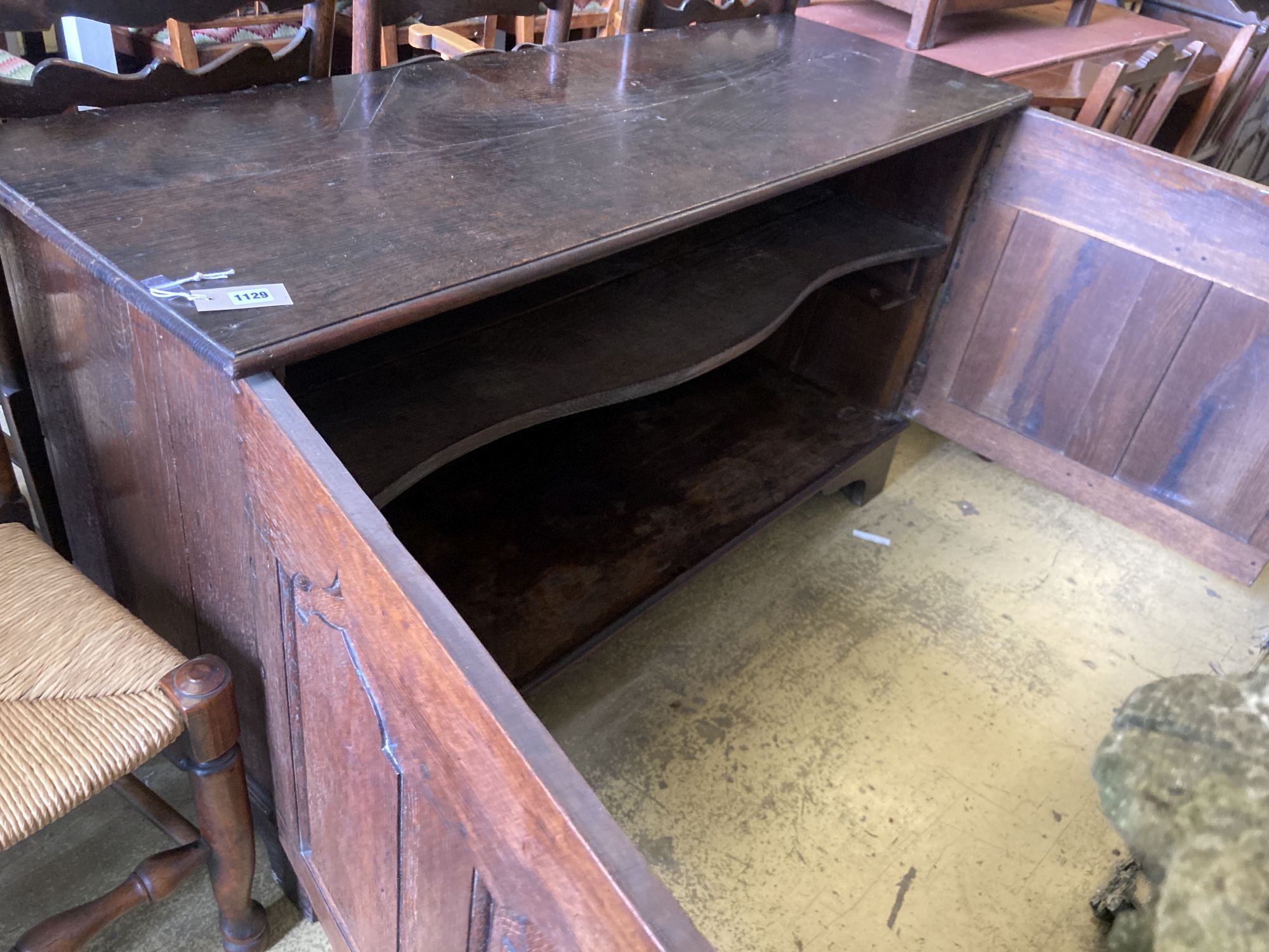 A mid 18th century oak two door cupboard, (converted from a coffer), width 144cm, depth 50cm, height 80cm